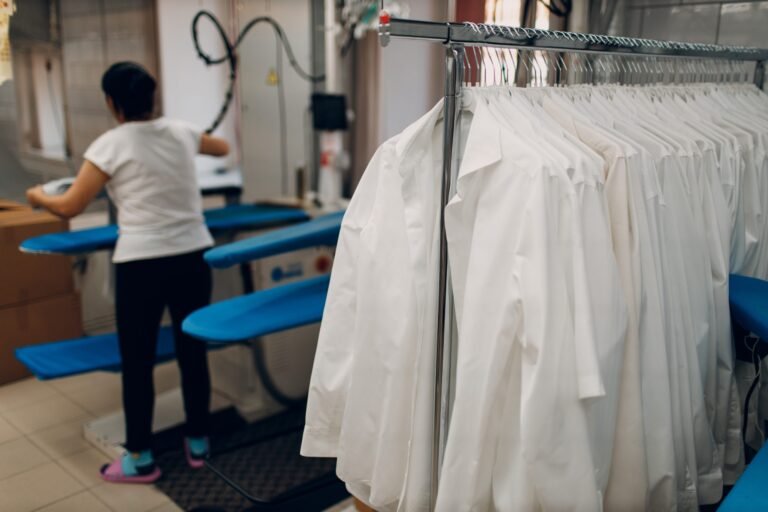 Careful fabric inspection and garment handling during professional dry cleaning